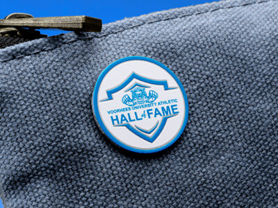 Round Voorhees University Hall of Fame USA rush printed pin fastened to a canvas bag