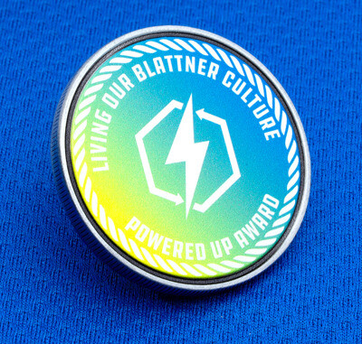 Round simulated enamel challenge coin with a green-to-blue gradient and rope border