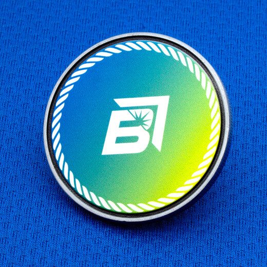 Simulated enamel challenge coin with a green-to-blue gradient face